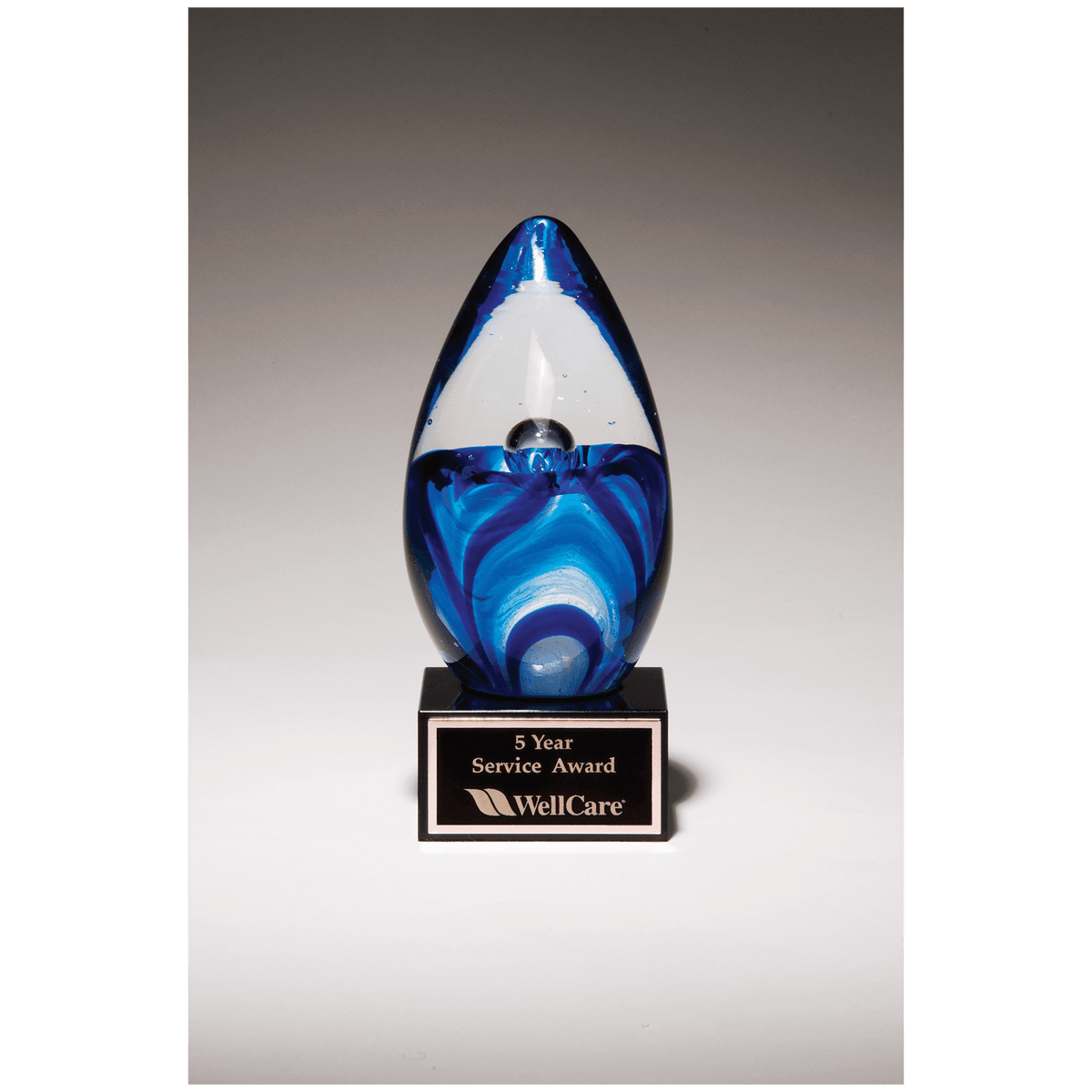 6 1/2" Blue Egg Shaped Art Glass on Black Glass Base — No Plate