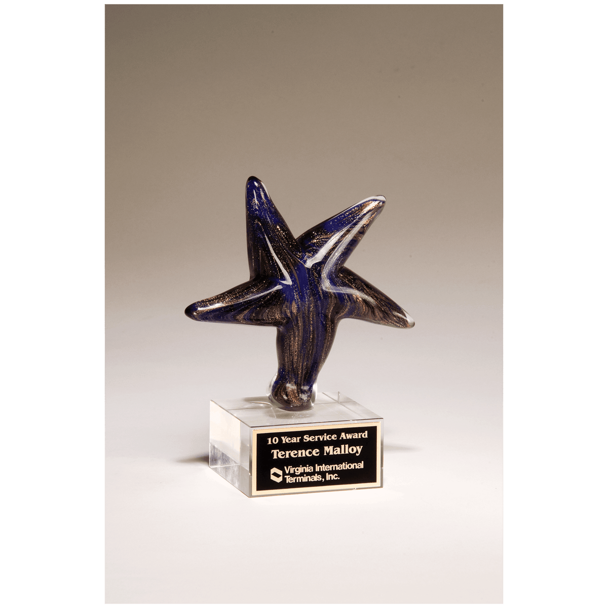 6 7/8" Blue Star Art Glass with Gold Metallic Highlights on Clear Glass Base and Black Laserable Aluminum Plate